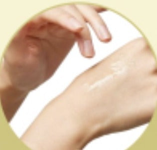 Applying arnica massage oil to skin during a post-surgery recovery massage