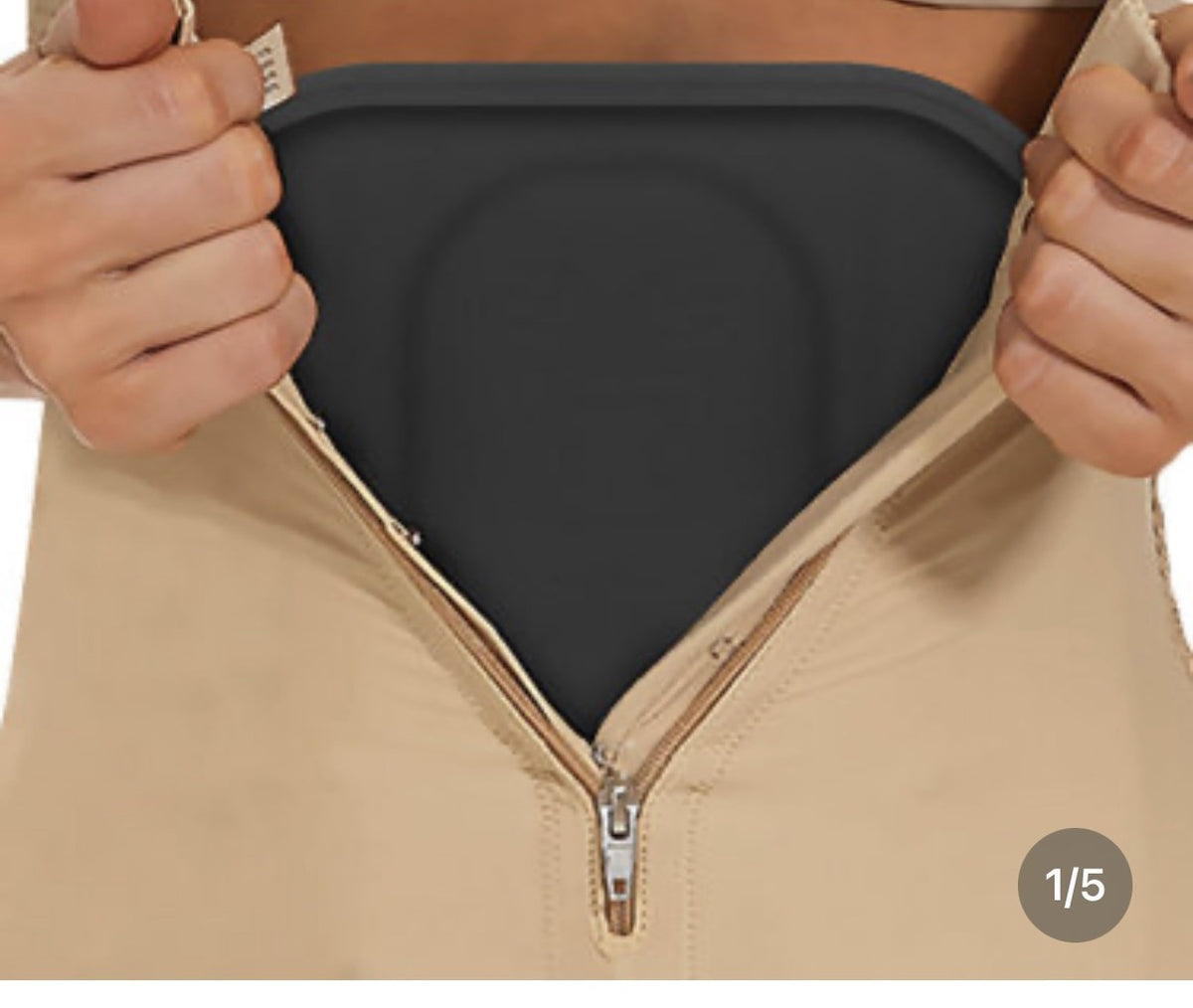 Foam drainage sponge positioned under a compression garment after surgery