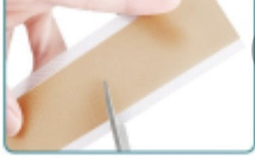 Cutting a silicone scar strip to size before applying to a surgical scar
